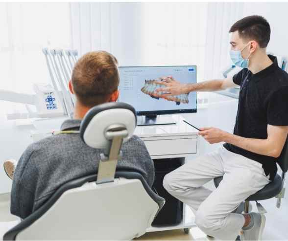 Patient discussing Invisalign treatment with dentist